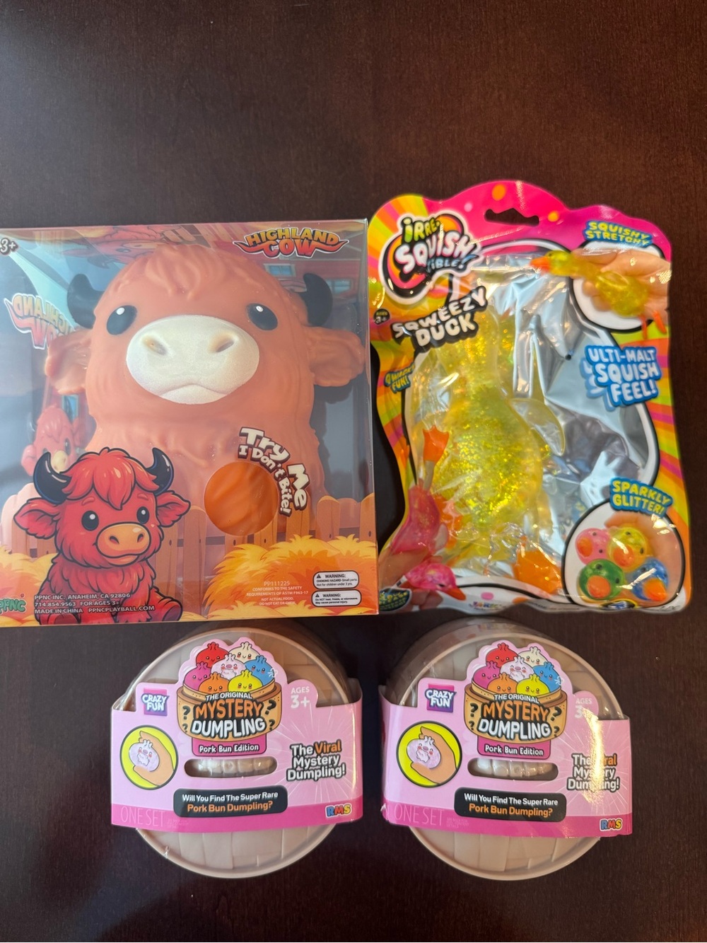 Squishy Lot of 4: Highland cow, sqweezy duck, & two RMS mystery pork dumplings